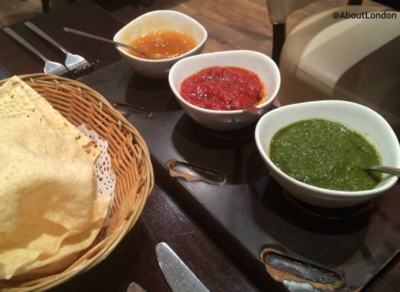 Papadoms and three chutneys: mango and pineapple, spicy, and mint