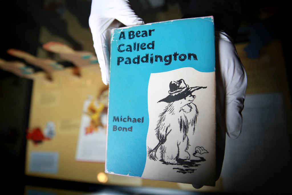 Curator Hilary Young prepares a signed first edition of the first ever Paddington story called A Bear Called Paddington. Image credit: Matt Alexander/PA Wire