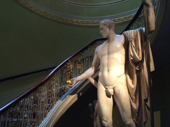 A larger than life-size statue of Napoleon in the stairwell.